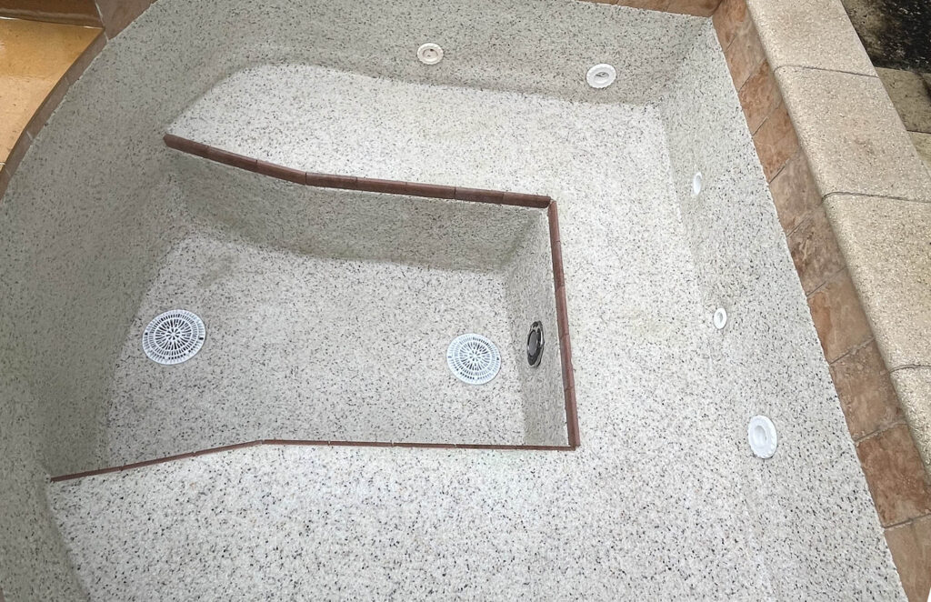 Pool acid bath guide example showing restored spa plaster surface after treatment