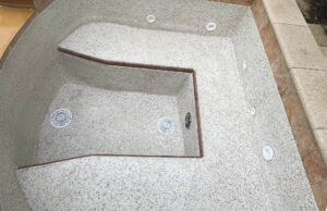 Pool acid bath guide example showing restored spa plaster surface after treatment