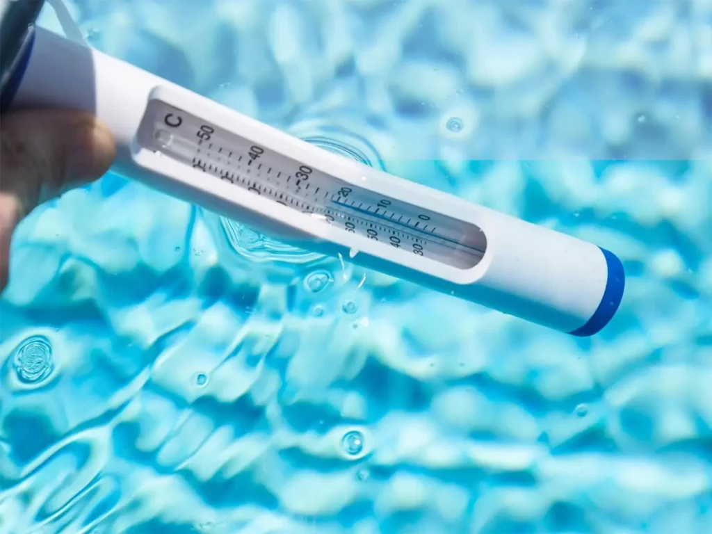 Pool water thermometer checking swimming pool temperature in South Florida.