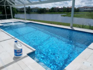Bleach in a swimming pool shown beside a clean residential swimming pool in Palm Beach County