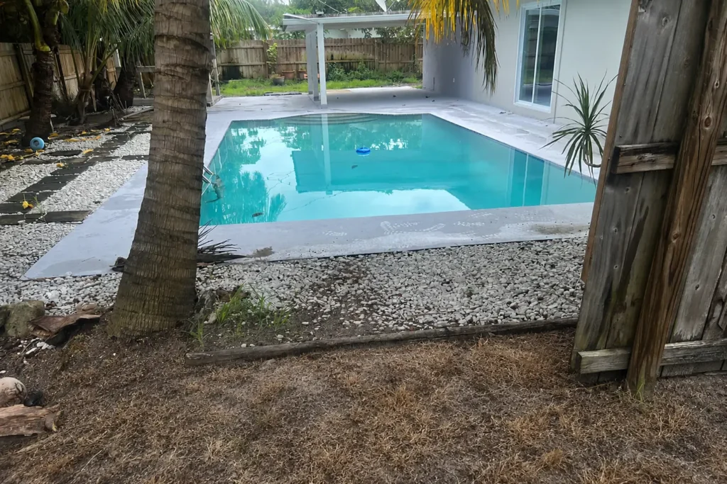 Does swimming pool water kill grass near a backyard pool in South Florida?