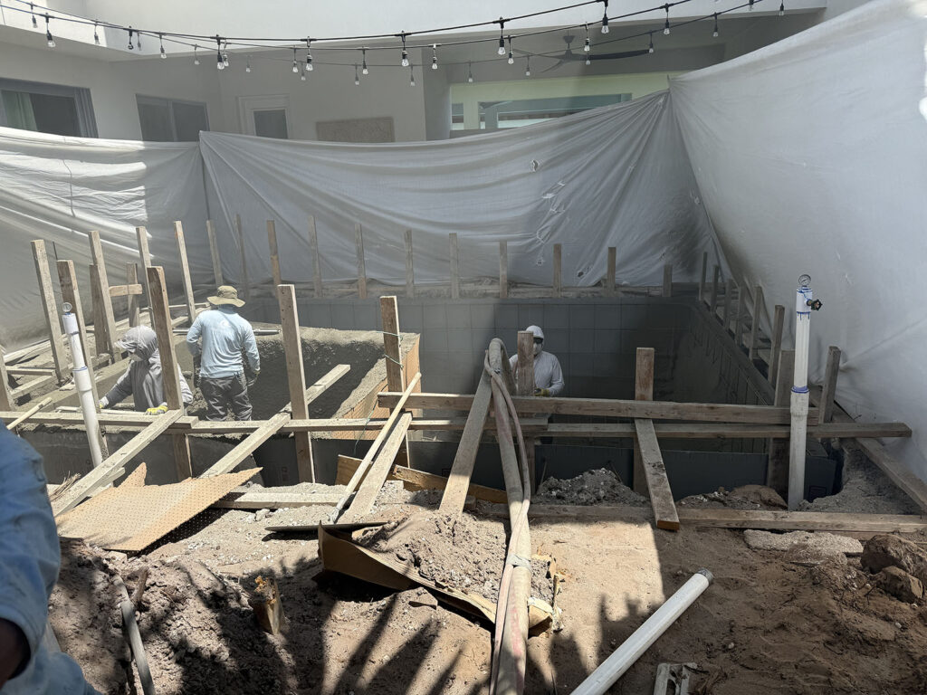 Pool construction in Palm Beach Gardens with structural work and plumbing installation underway