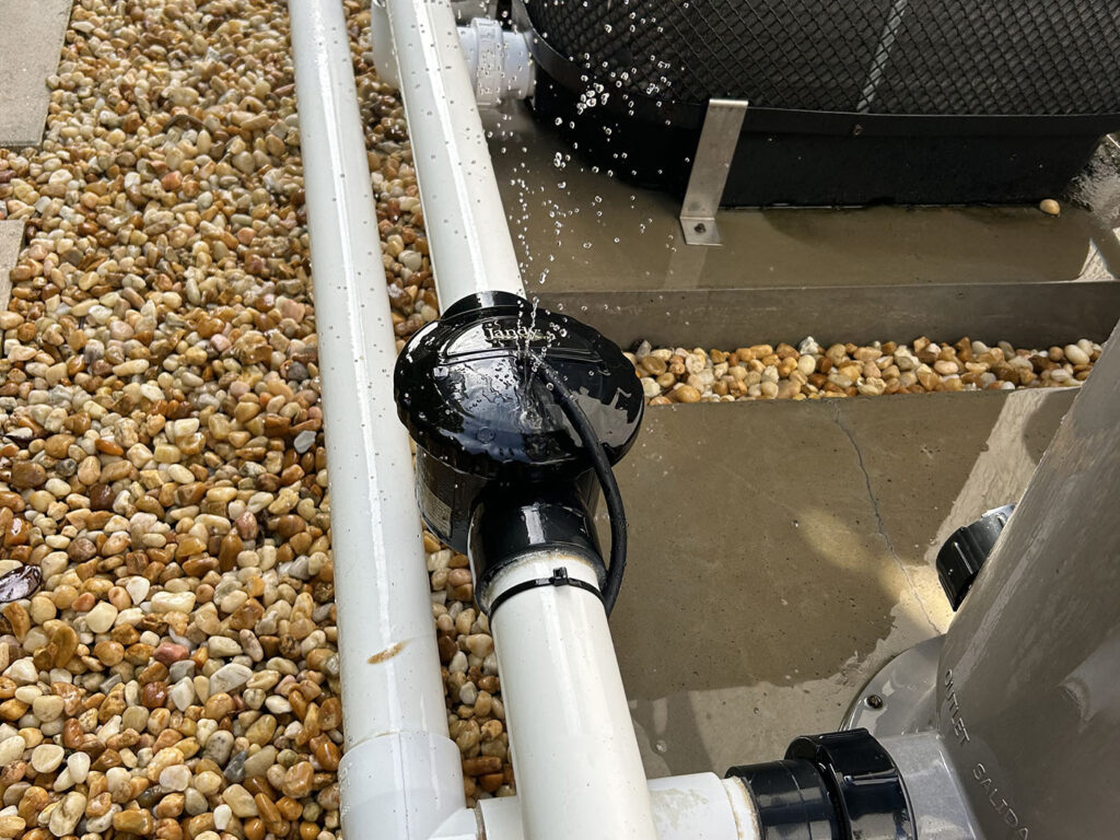 Pool repair Jupiter FL with visible plumbing repair near pool equipment
