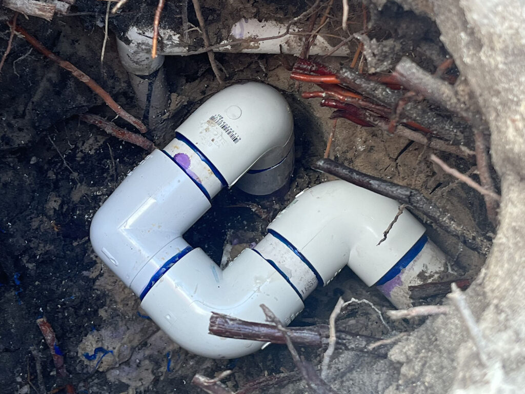 Underground pool plumbing repair in progress at a home in West Palm Beach