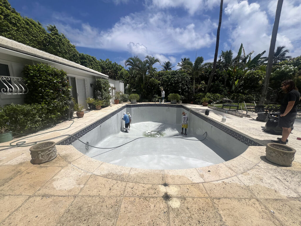 Pool resurfacing project in progress at a residential home in West Palm Beach