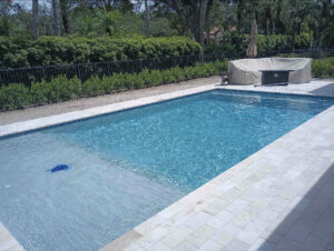 A clean residential swimming pool in Florida, highlighting saltwater pool benefits for homeowners.