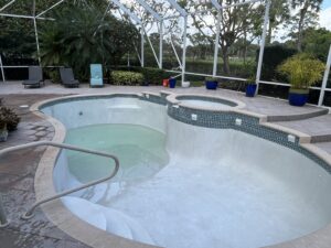 Pool resurfacing and property value improvement with quartz finish