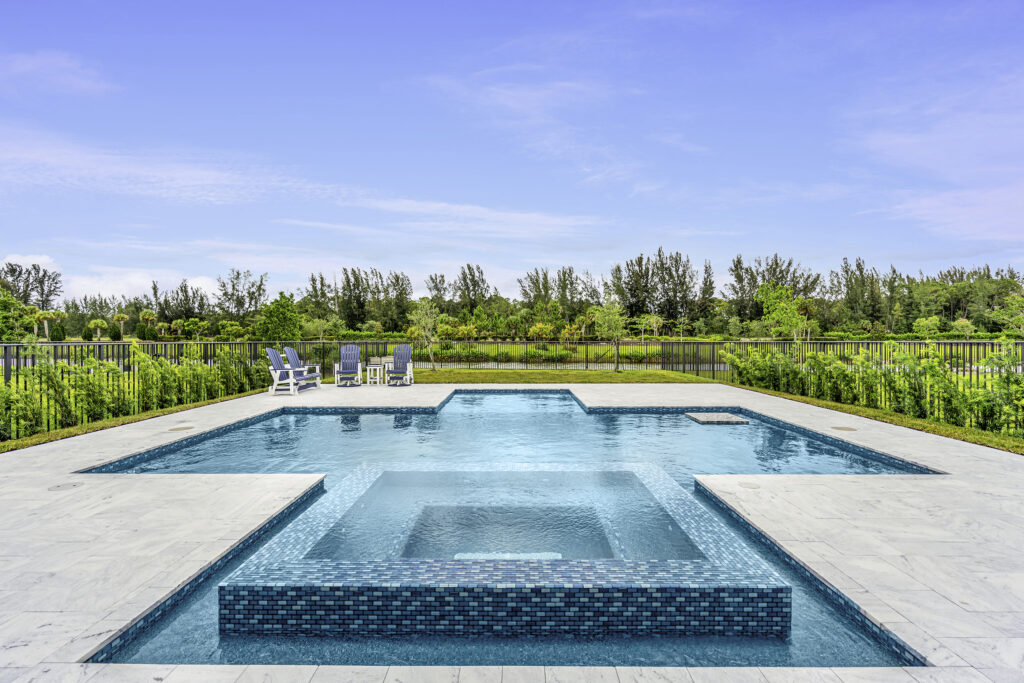 Luxury backyard pool in Palm Beach Gardens with clean, inviting water including a spa