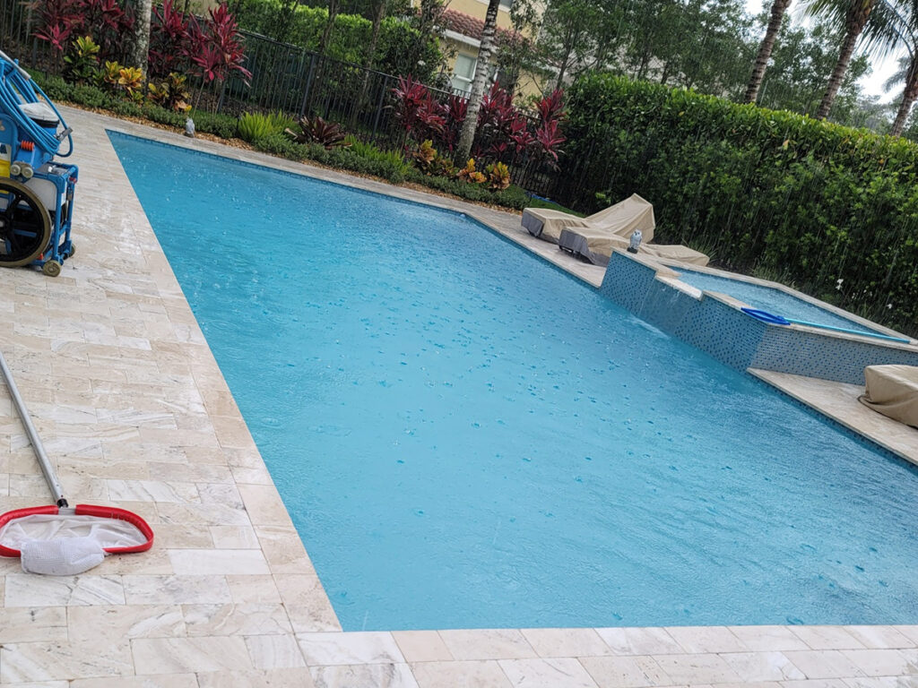 Clean residential swimming pool after professional maintenance service