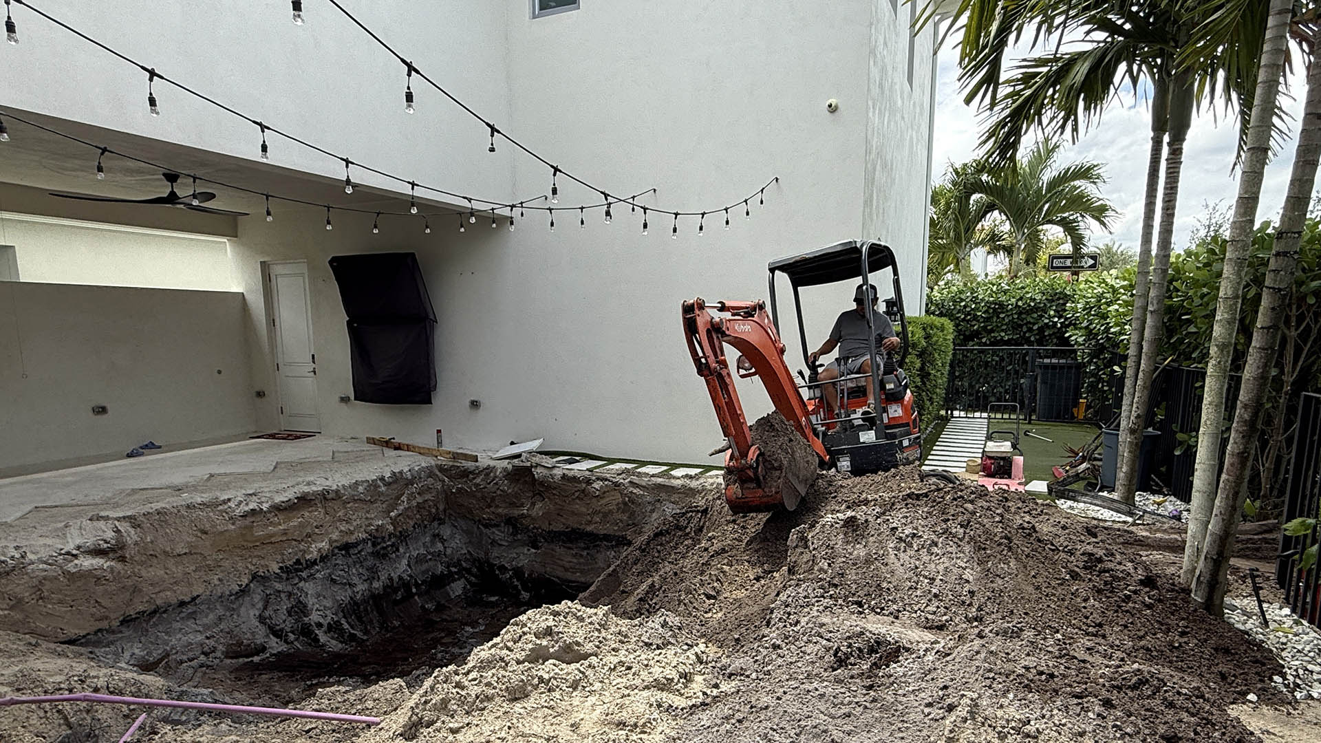 Excavation site for a new backyard pool in Florida – an early step in a homeowner's guide to new pool construction
