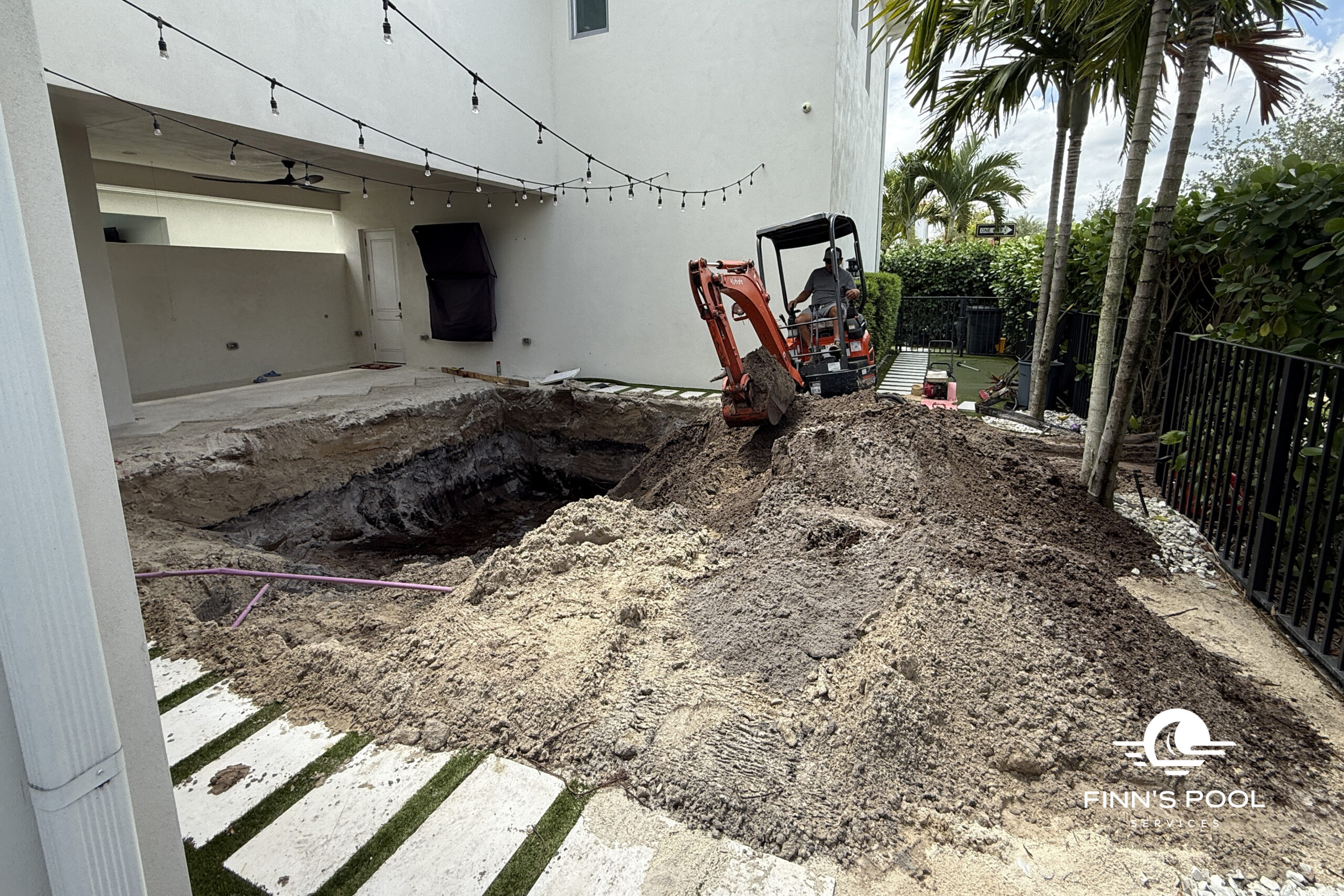 Excavation site for a new backyard pool in Florida – an early step in a homeowner's guide to new pool construction