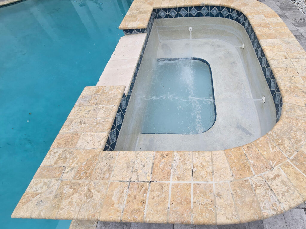 Spa and pool combo showing visible water loss – emergency pool leak detection and repair needed.