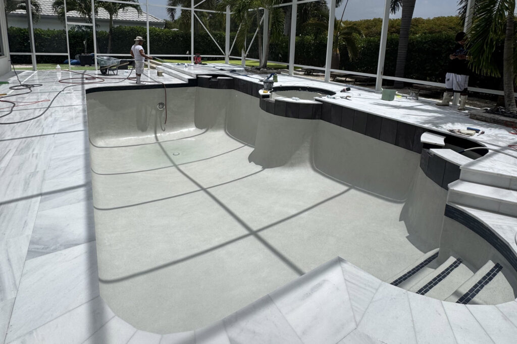Surface preparation during pool resurfacing in Palm Beach Gardens