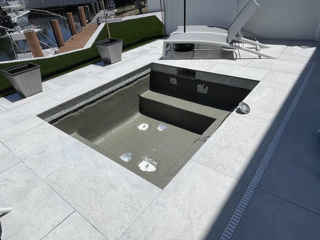 Fresh pool plaster surface prepared for professional start-up service