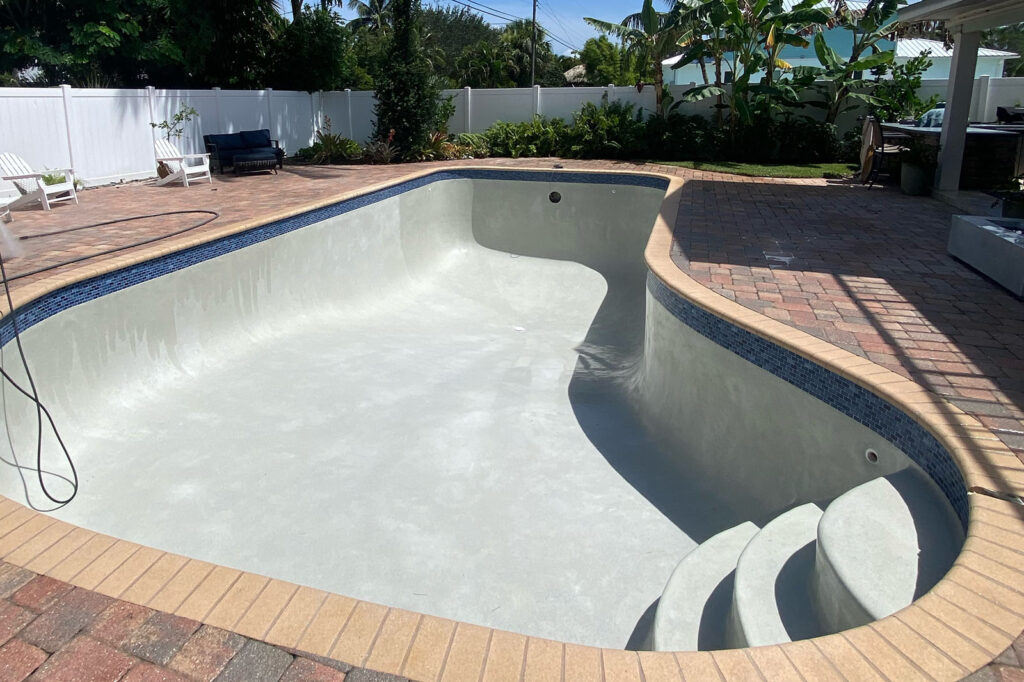 Freshly resurfaced pool with new plaster before the curing process begins