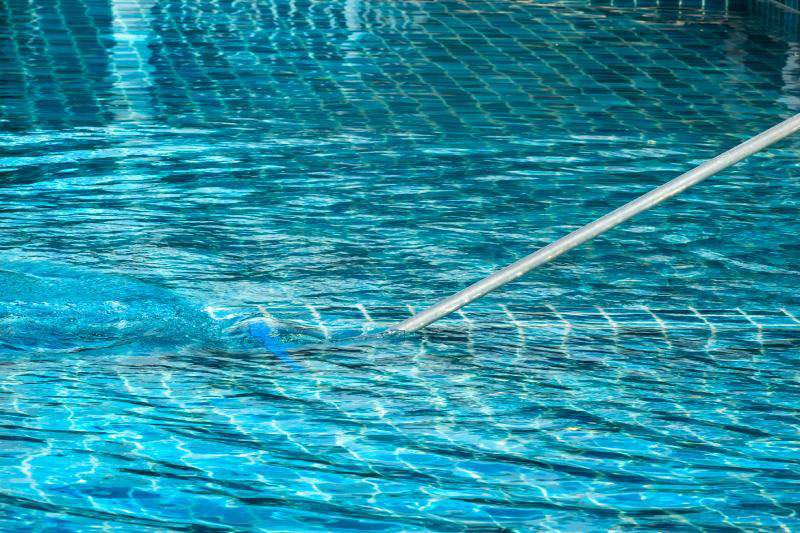 Routine pool cleaning to maintain water balance and equipment performance