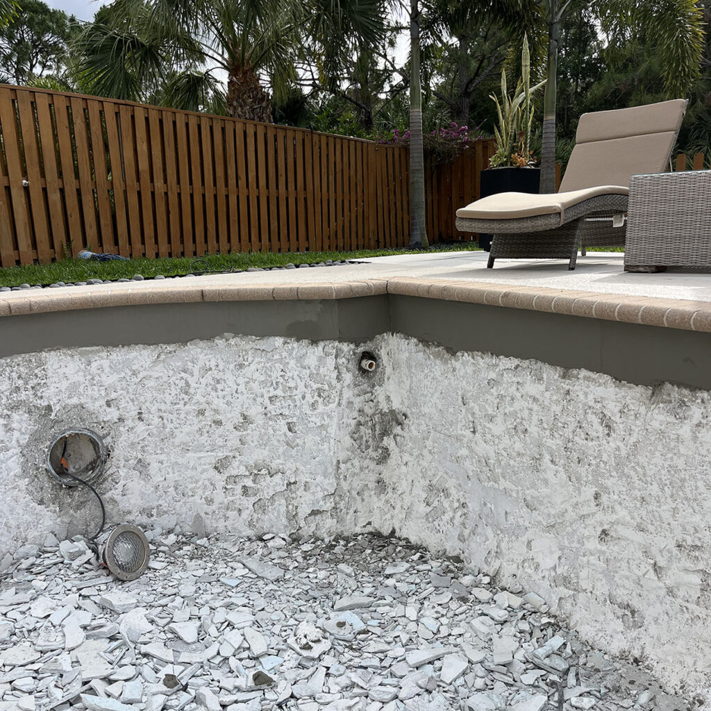 Pool repair Palm Beach Gardens showing exposed pool shell during structural repair