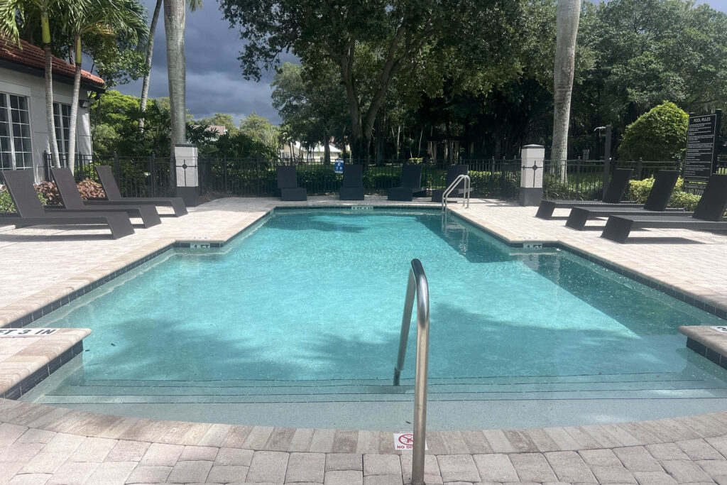 Community swimming pool in West Palm Beach operating year round in Florida heat