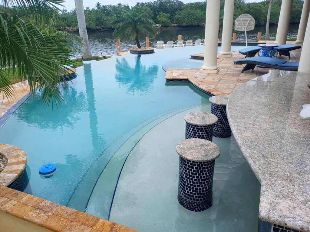 Waterfront residential pool along the Intracoastal in Palm Beach County exposed to salt air and intense sun
