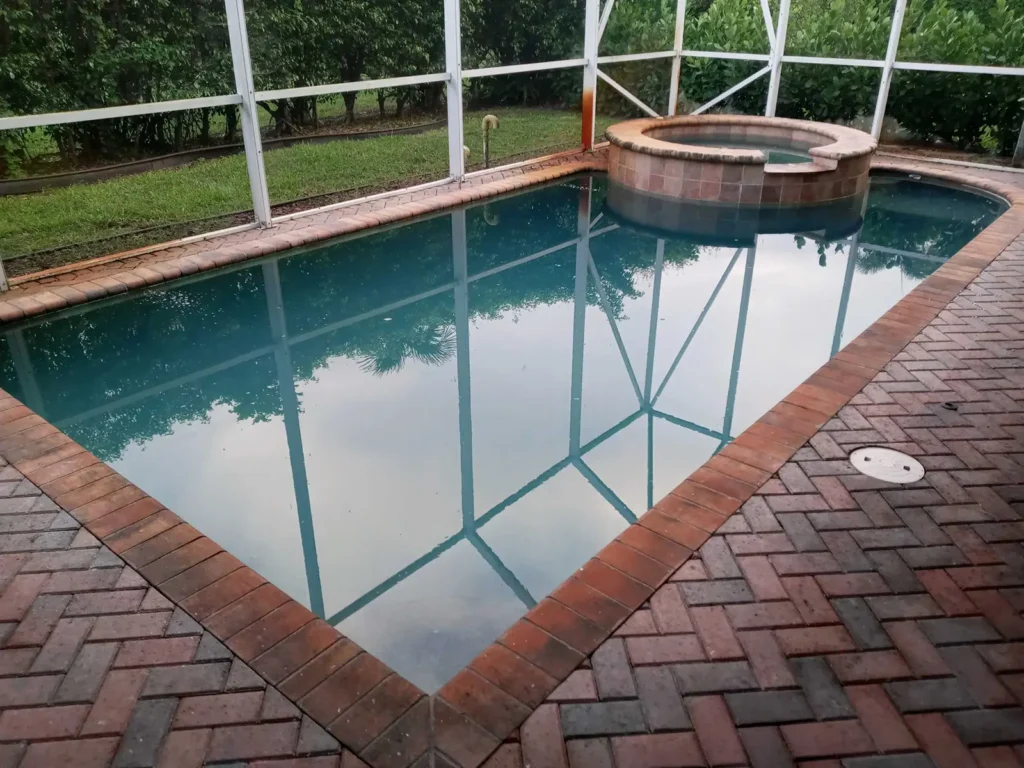 Cloudy swimming pool water caused by poor maintenance and weather-related imbalance in Florida.
