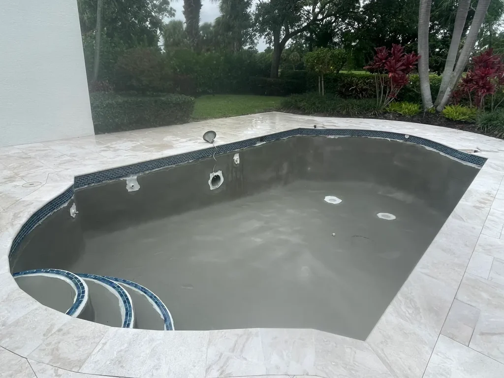 Residential swimming pool during resurfacing preparation before final finish application in Palm Beach County, Florida.