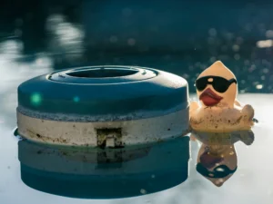 Floating chlorine dispenser in a swimming pool during hot summer weather